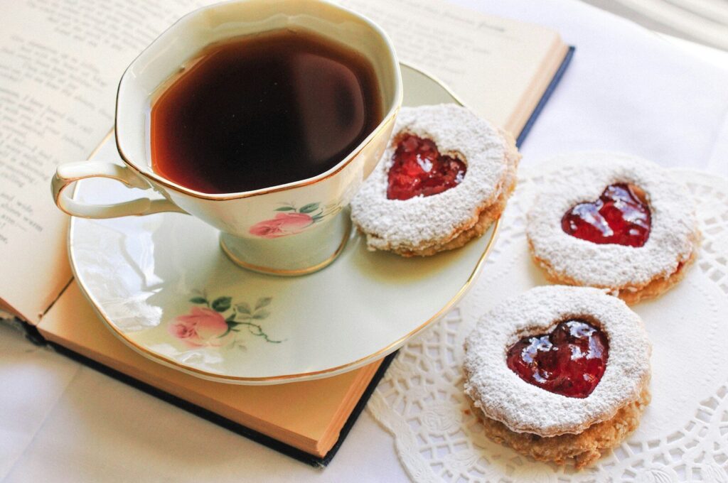 a cup of tea and some cookies on a plate